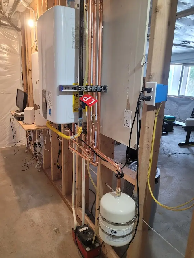 Licensed plumber repairing a kitchen sink in Urbana